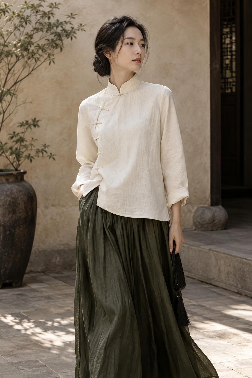 Textured ivory blouse with a considered neckline